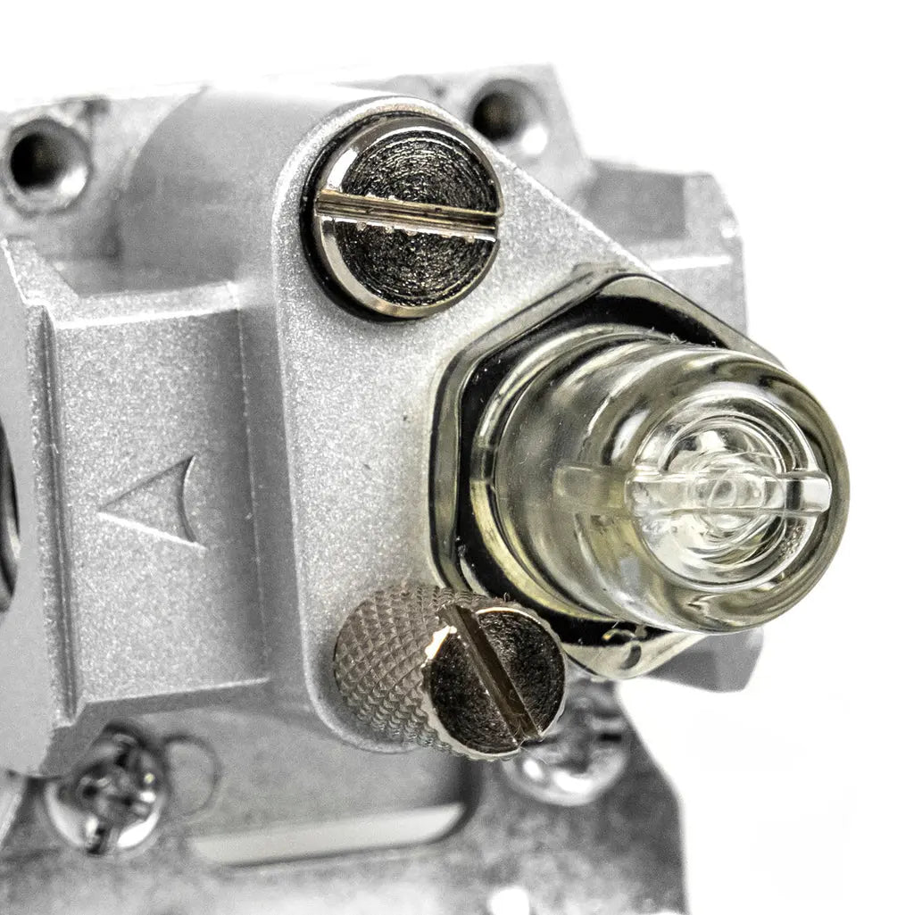 Close-up of the lubricator fill port and adjustable oil-delivery screw