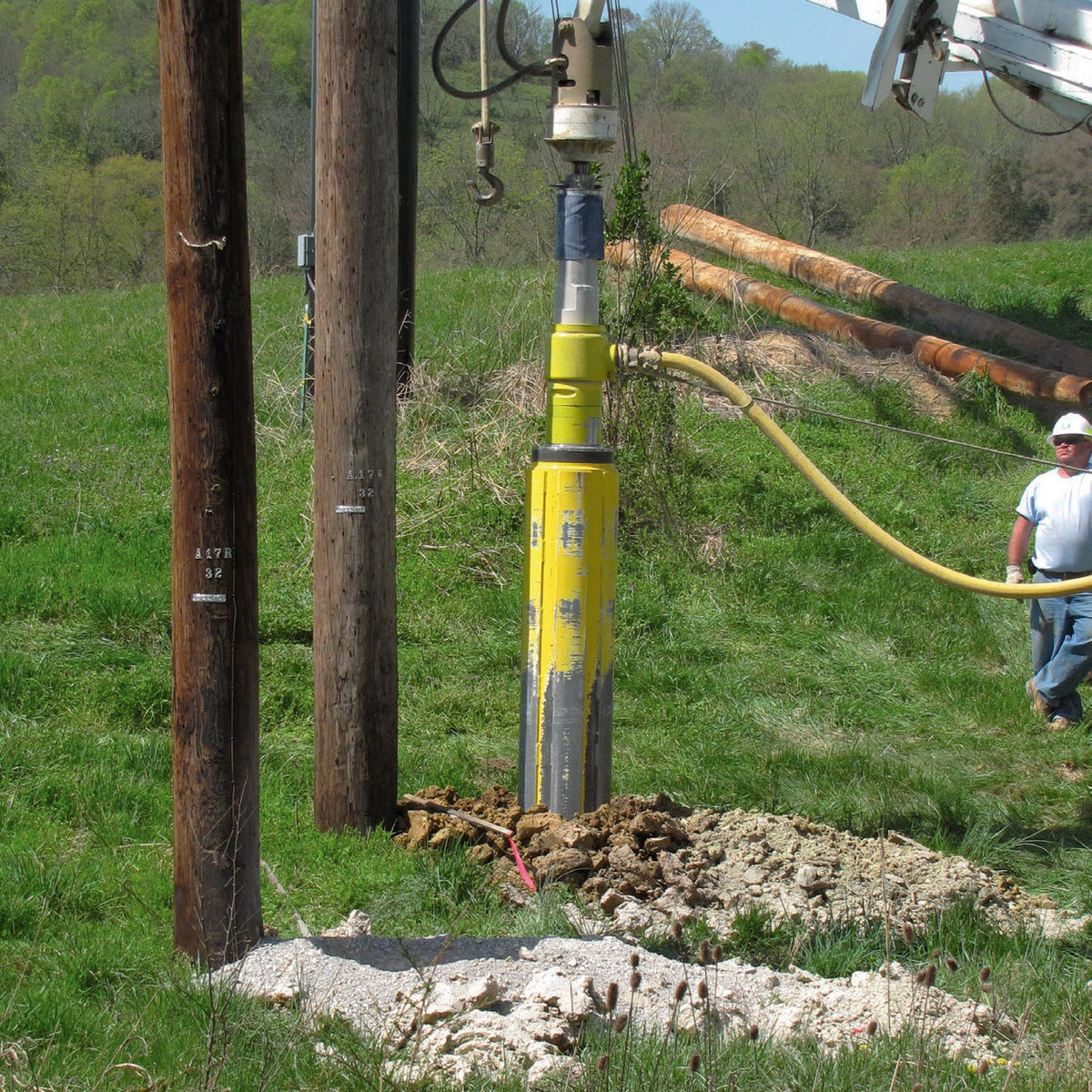 TerraRoc PPD 120 drilling a rock pole socket from a utility derrick truck